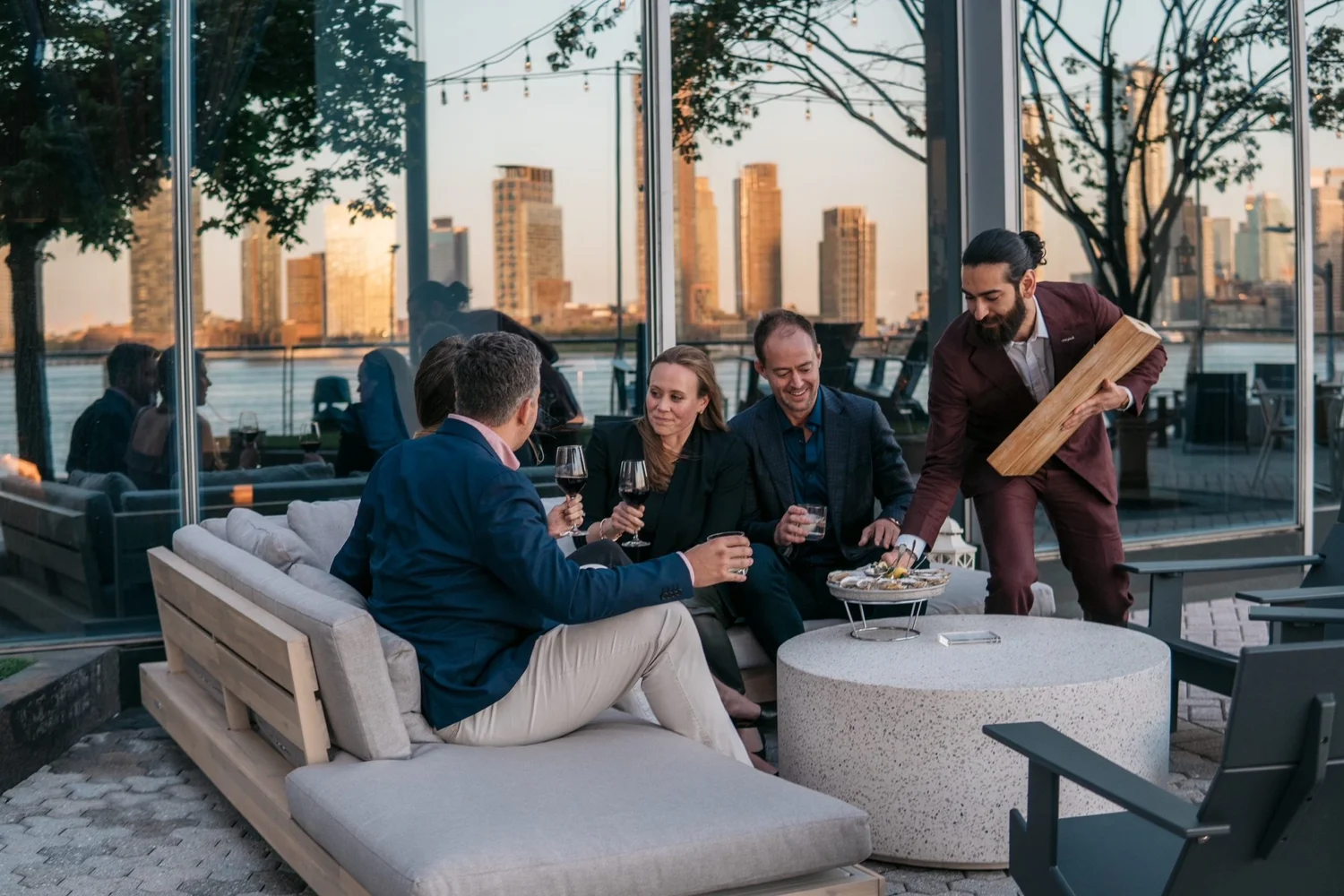 Guests dining on the Riverpark terrace