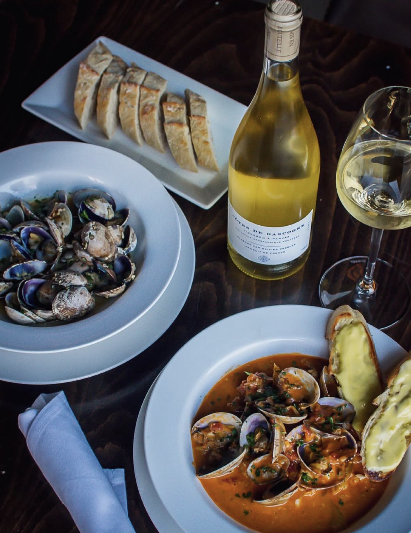 Clams, bread, wine, and seafood photographed for Nectar